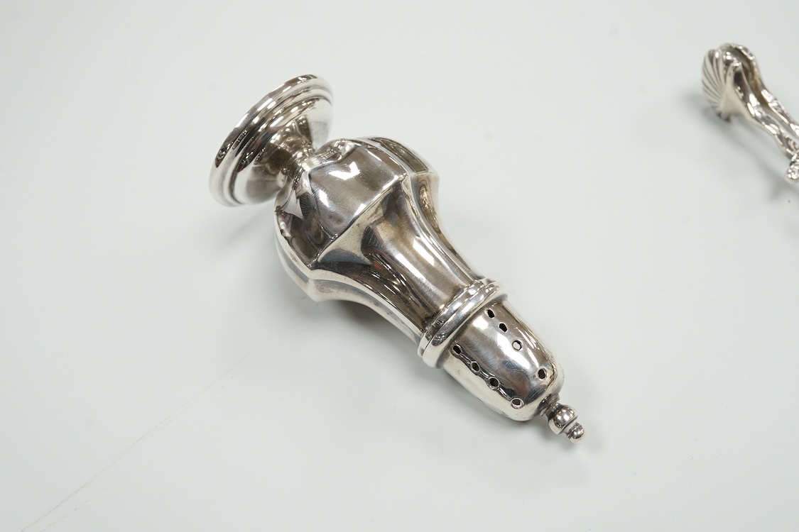 A late Victorian repousse silver navette shaped dish, by Charles Edwards, London, 1894, 25.7cm, with engraved monogram and date, together with a pair of mid 18th century silver sugar nips, an early 19th century silver vi